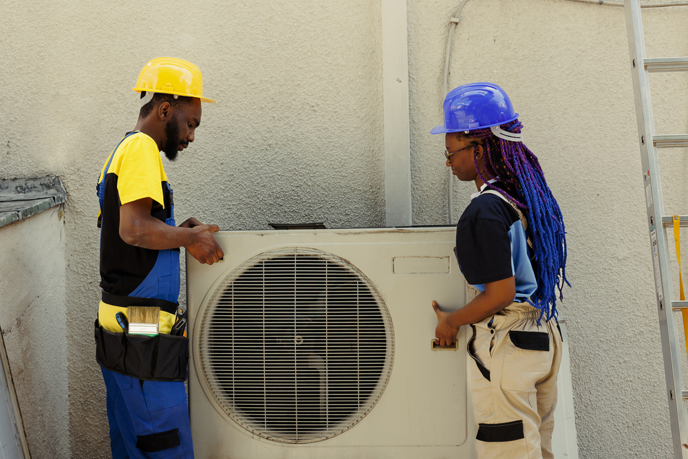 Engineers opening rusty air conditioner